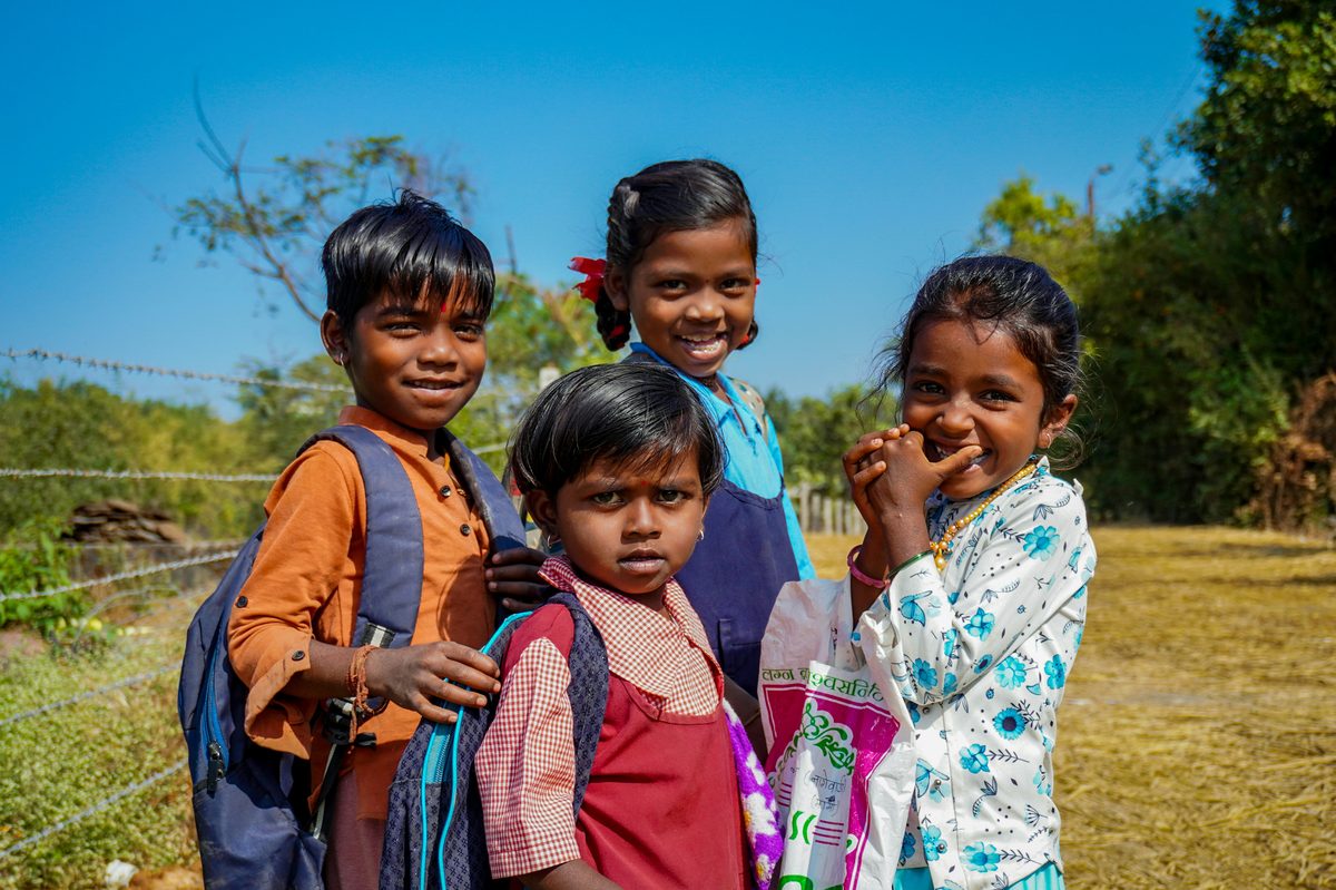 Children smiling together outdoors